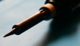 solder-iron-laying-on-table